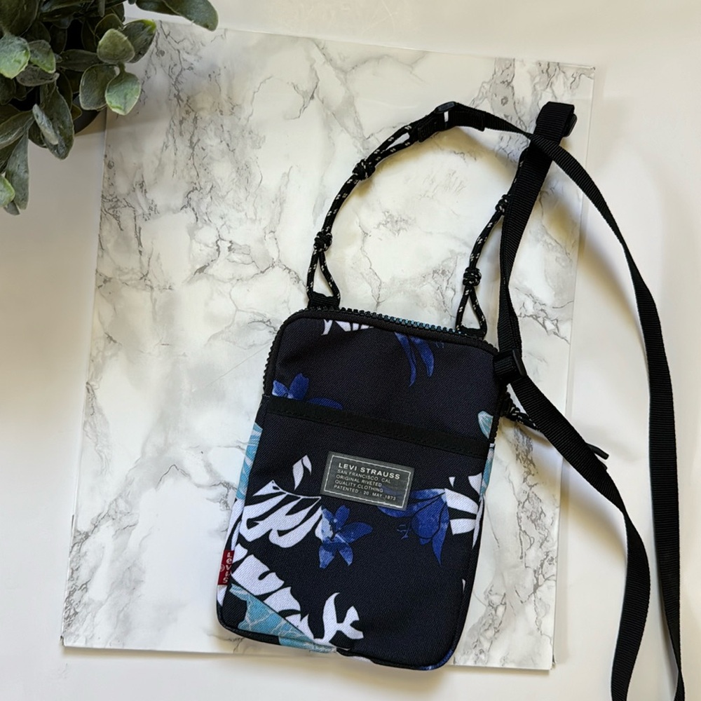Levi's Stratuss Co. Women's multicolor banana leaf floral crossbody bag .